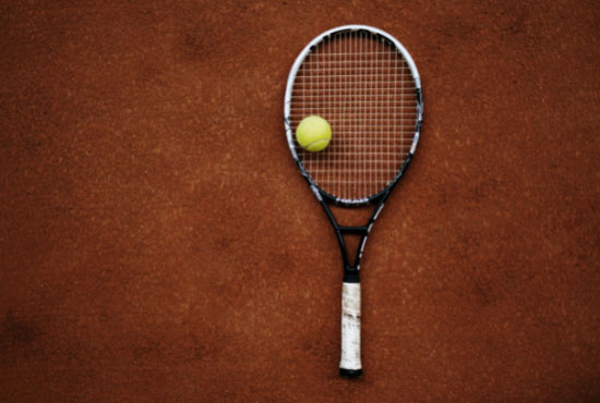A Tennis Racket And a Tennis Ball