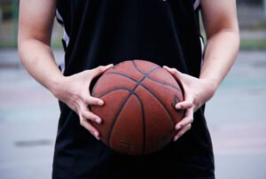 A men holding a basketball