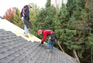 Carpenter Installing Roof Shingles